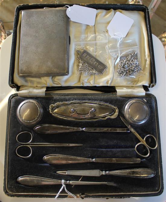 Silver cigarette case, silver-mounted manicure set, cased (af), 2 silver ingots on chain & a charm